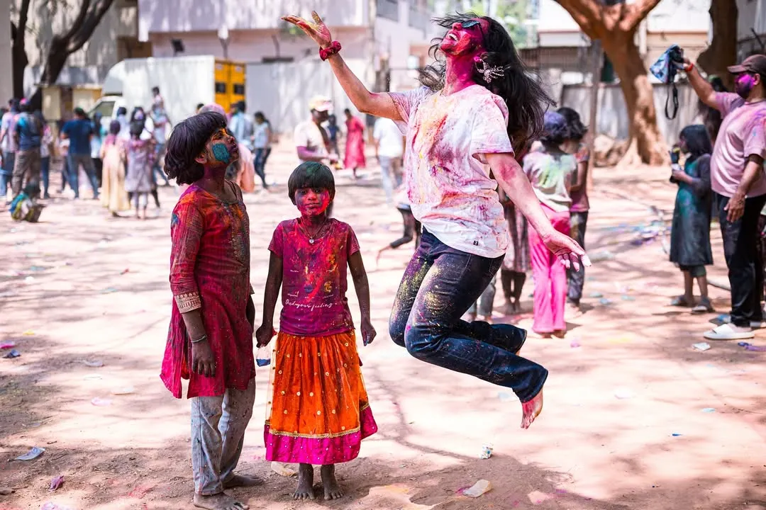 Capturing the peak of Holi fun. This is the kind of high-energy, joyful moment I love to create at festival parties, getting everyone, including the kids, to jump, dance, and celebrate with color.