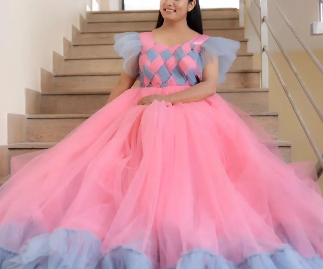 Here's a look at one of our custom-designed ball gowns, worn by the lovely Suguna. The unique pink and grey checkered bodice and full tulle skirt make it a real showstopper for any event or portfolio shoot.