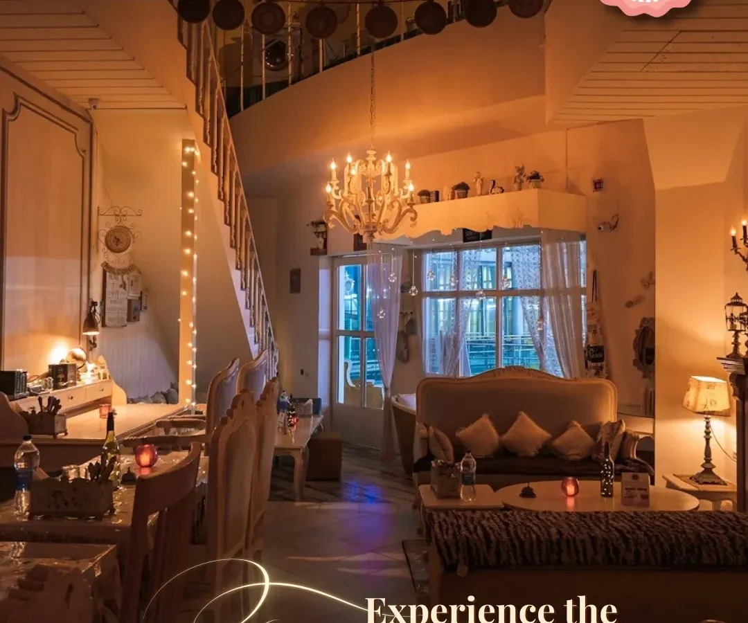 Inside, you'll find a world of French elegance. With sparkling chandeliers, cozy seating, and vintage details at every turn, the ambiance is set for you to relax, connect, and make beautiful memories.