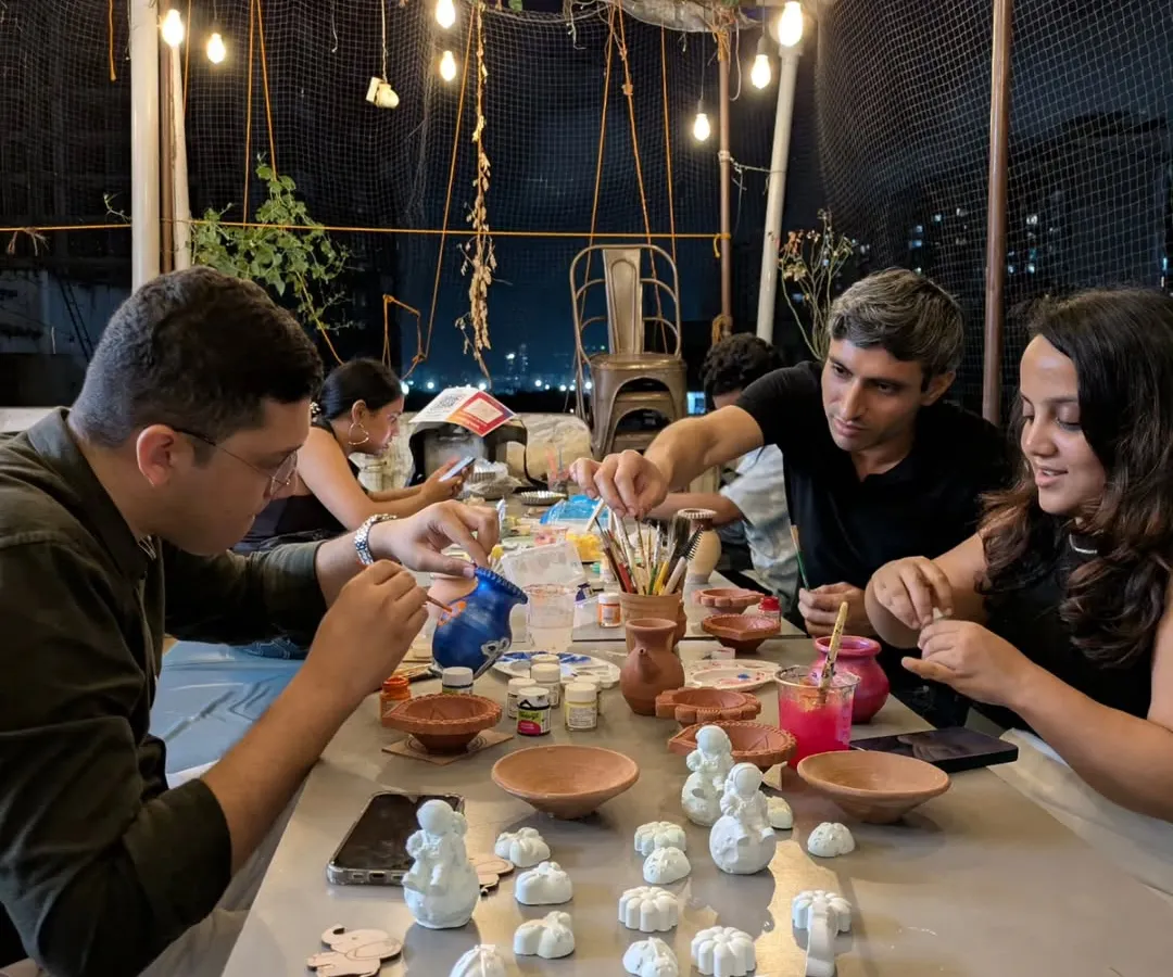 The studio truly comes alive at night. Under the glow of string lights, friends and couples gather to paint their creations, turning simple clay into personal treasures. This is what our evening painting sessions look like.