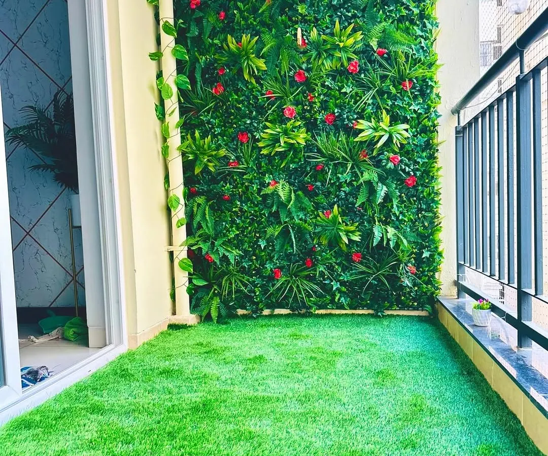 A complete balcony makeover in a Bangalore apartment. We installed our soft, durable turf on the floor and created a custom vertical garden wall with pops of red, turning a standard balcony into a private, vibrant oasis.