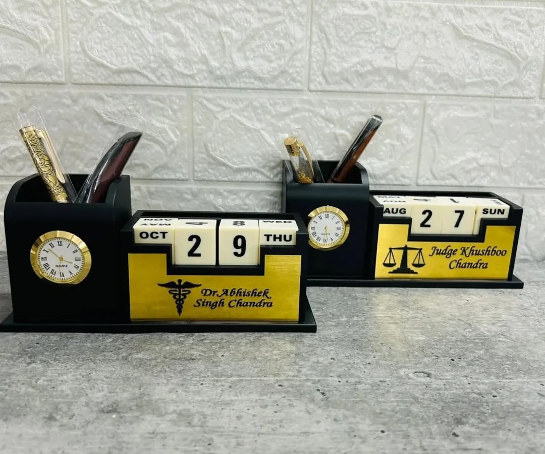 I craft these professional desk organizers that combine a lifetime calendar, a clock, and a pen stand. Here you can see two examples customized for a doctor and a judge, showing how I can tailor them with specific names and professional symbols.