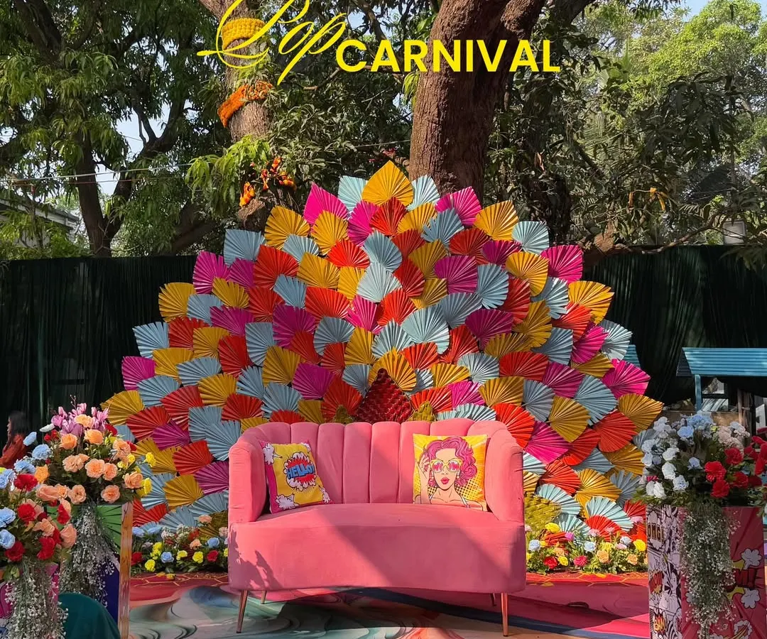 A Haldi ceremony should be an explosion of joy. For Jay and Jinal's 'Pop Carnival' theme, I used a riot of color, quirky pop-art cushions, and a dramatic fan-style backdrop to create a fun, high-energy photo spot that perfectly captured their vibrant personalities.