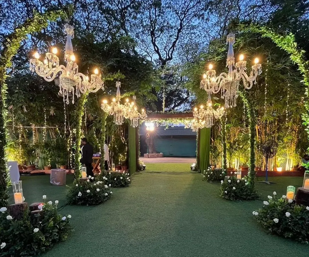 We create magical beginnings with enchanting entrance walkways. Here, lush greenery and elegant crystal chandeliers guide you and your guests into a world of celebration, setting a tone of sophisticated romance for the evening ahead.