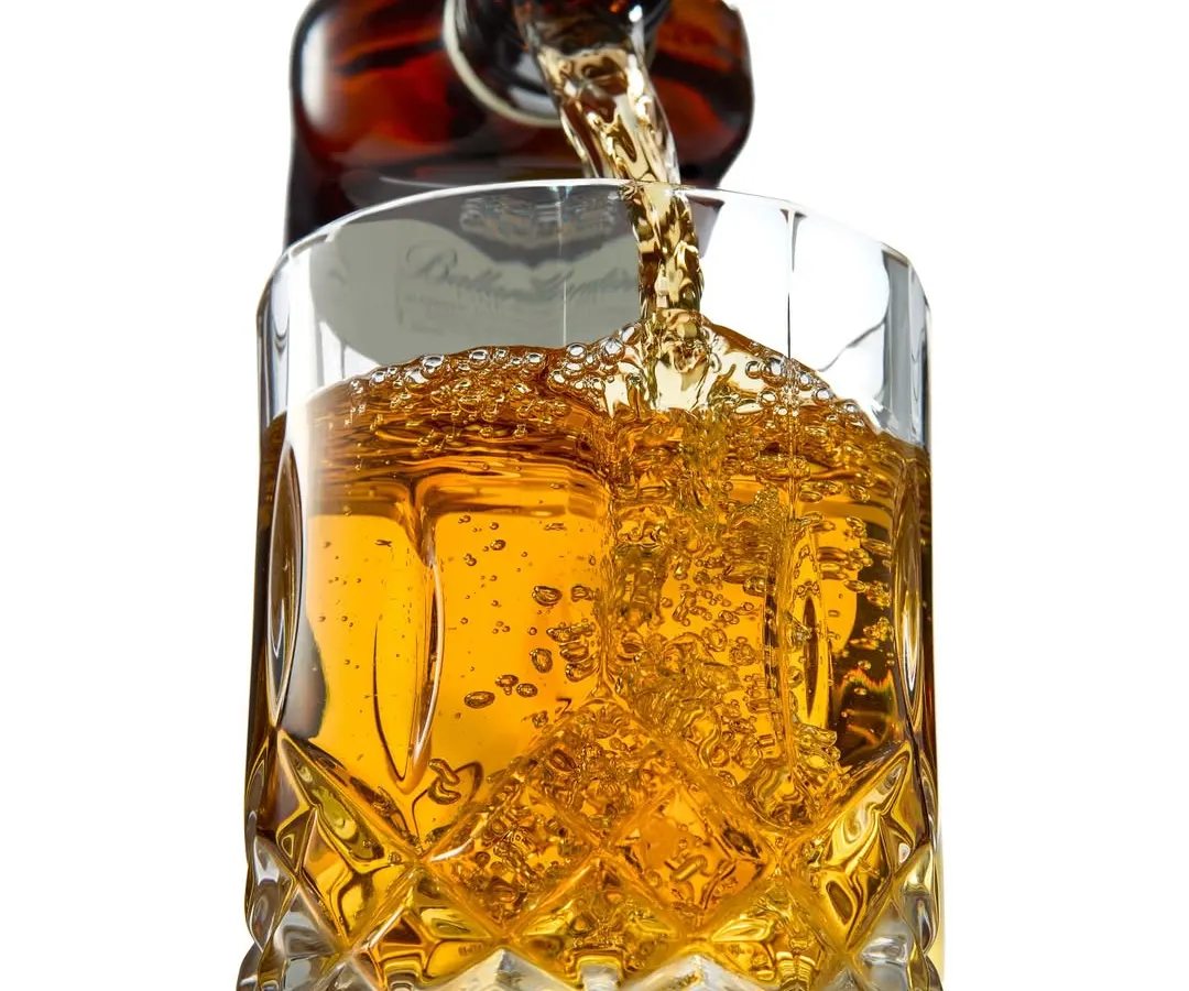 Capturing the perfect whiskey pour is all about timing and light. For this shot, I focused on freezing the motion to show the rich amber color and the energy of the splash, creating a sense of elegance and movement for beverage brands.