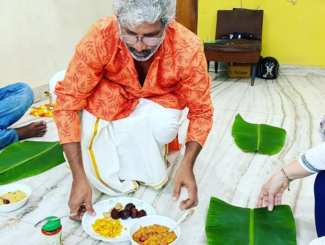Here I am, preparing for an Onam Sadya at home. I believe in the personal touch, so I prepare and serve every dish myself, ensuring the meal is authentic and made with care.