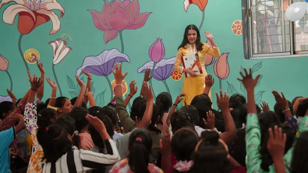 The moment a story comes to life. Here at our Library of Flowers, our volunteer captivates an audience of eager listeners. Every raised hand is a sign of curiosity sparked and a connection made, showing the immediate impact of our storytelling programs.