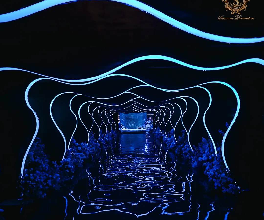 I believe an entrance should be a portal to another world. For this cosmic-themed engagement, guests journeyed through a futuristic tunnel of flowing light, a dramatic transition that prepared them for the stellar celebration that awaited.