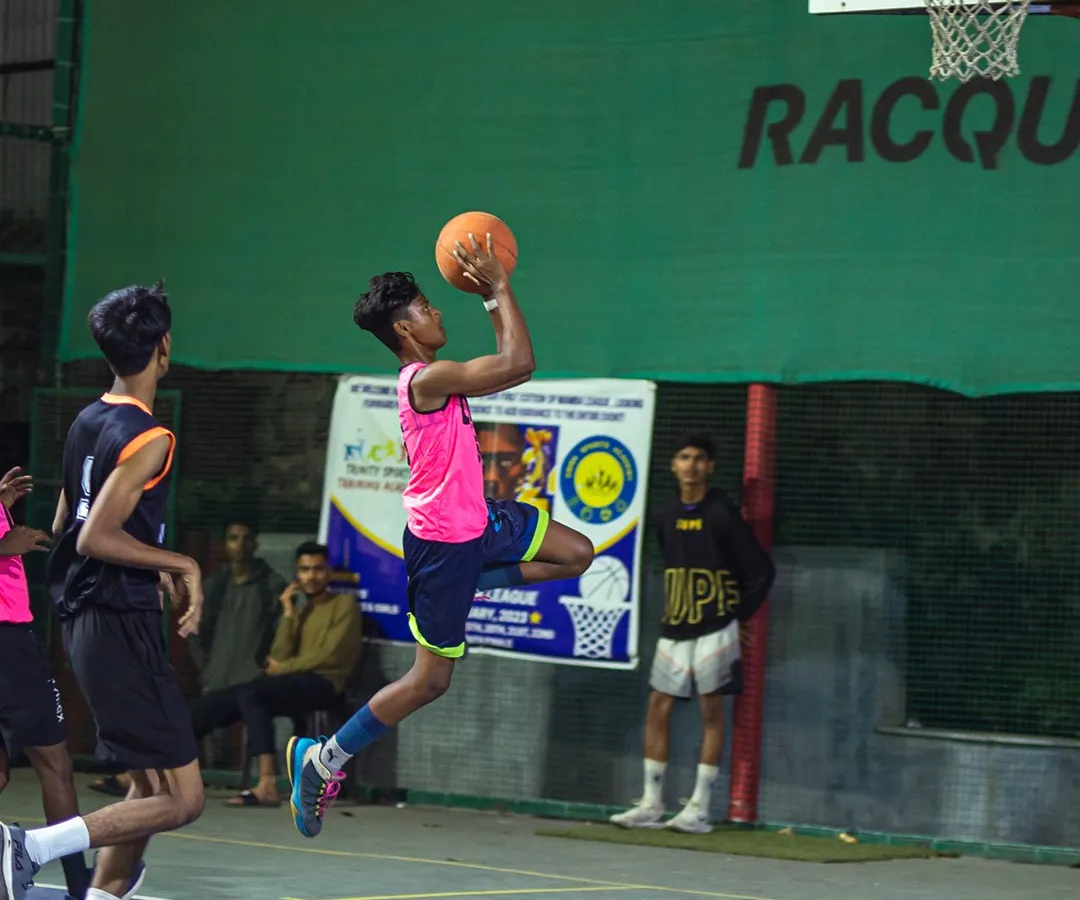 Feel the thrill of the game under the lights. This action shot from a night match on our basketball court captures the intensity and passion our players bring to every game.