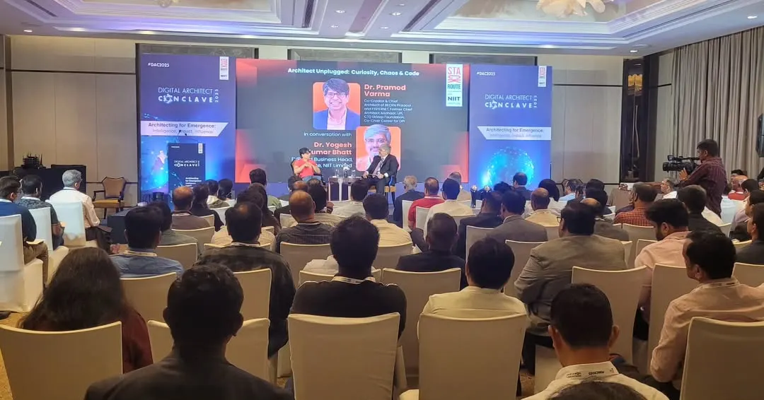 A live panel discussion in progress at the Digital Architect Conclave. This shot shows a fully engaged audience and our seamless on-stage production, including the main LED screen and side panels for branding.