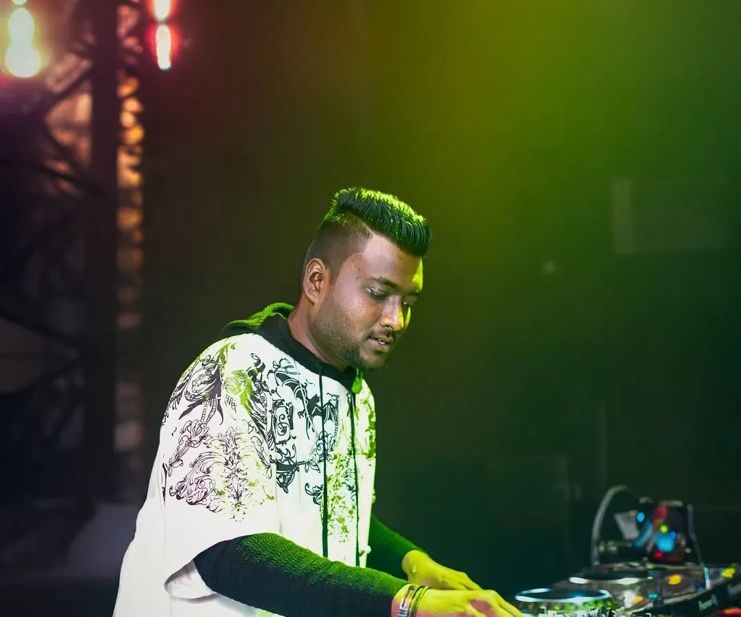 In the zone during a set. Mastering the art of DJing is about focus and precision, and I'll guide you through every technique, from basic beatmatching to advanced mixing, right here in Bangalore.