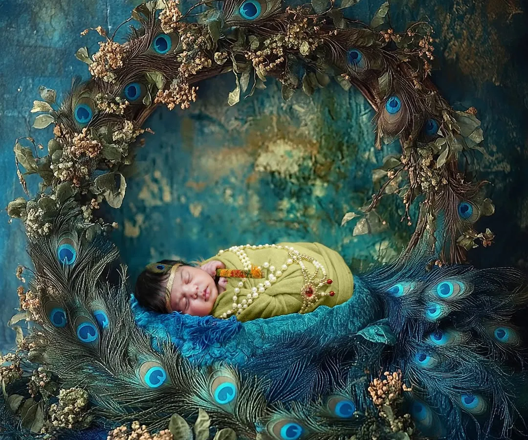 Capturing the divine innocence of a newborn as little Kanha, nestled in a wreath of peacock feathers. I meticulously design these setups, like this one in my Vashi studio, to create a truly magical and timeless portrait of your baby's first days.