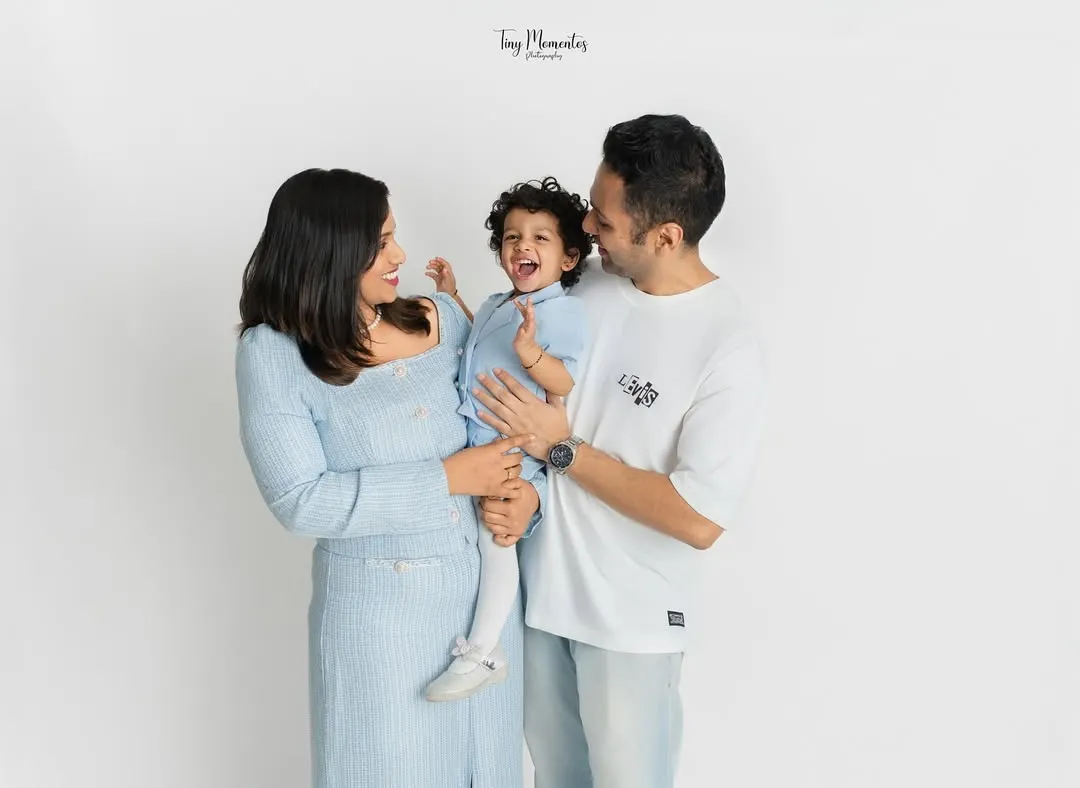 There is nothing more precious than a shared laugh. In my clean and simple studio space, your family's connection becomes the main focus, allowing for authentic moments like this to shine.