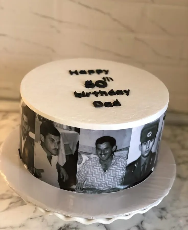 This cake was created to celebrate an 80th birthday for a beloved dad. I used a series of his life photos to create an edible memory lane wrapped around the cake. The simple message on top keeps the focus on the pictures, making it a deeply personal and heartfelt gift.