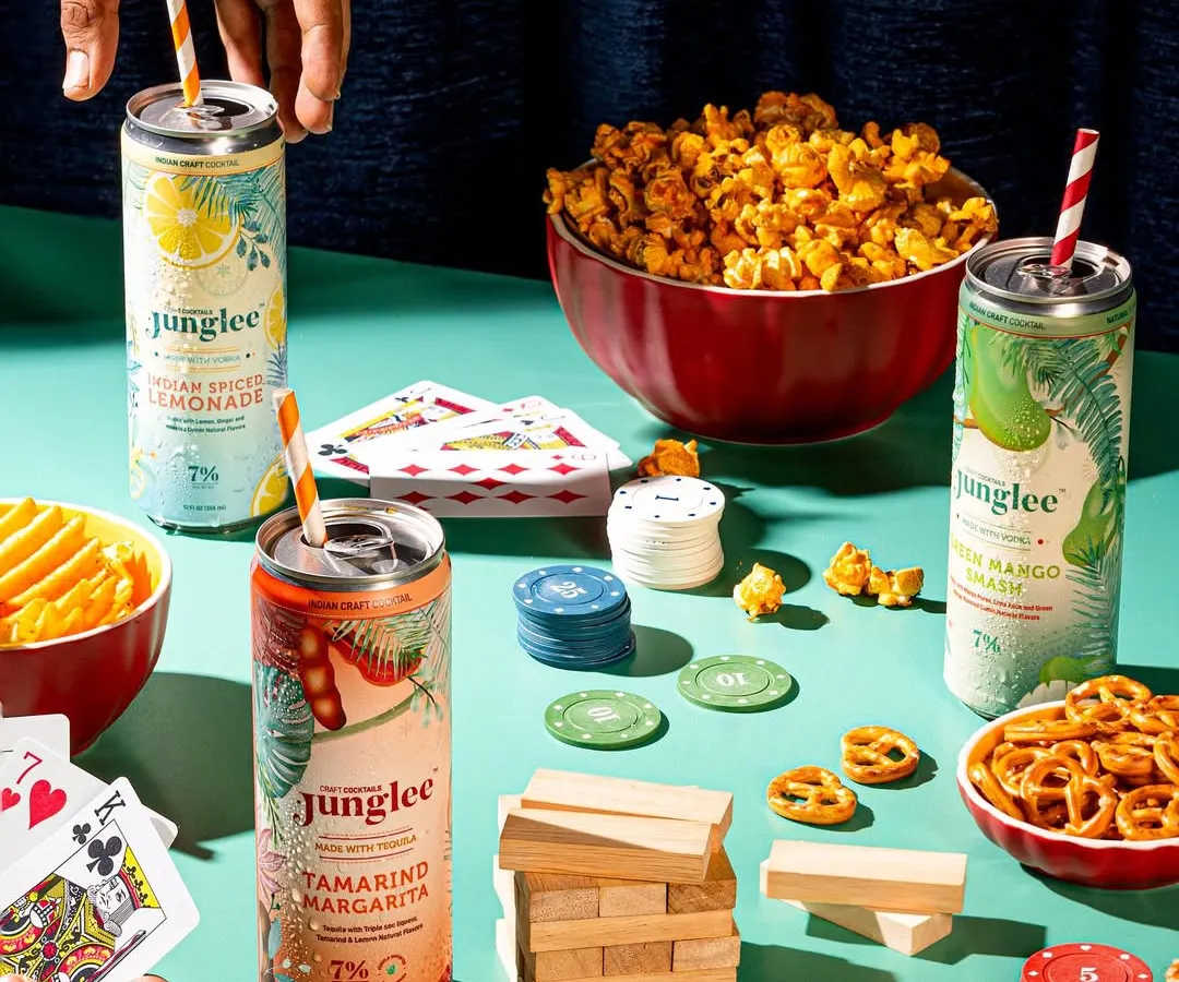 We create entire worlds around a product. This lifestyle shoot for Junglee's canned cocktails was designed to feel like a real game night with friends, showing the drinks as a natural part of a fun, social experience.