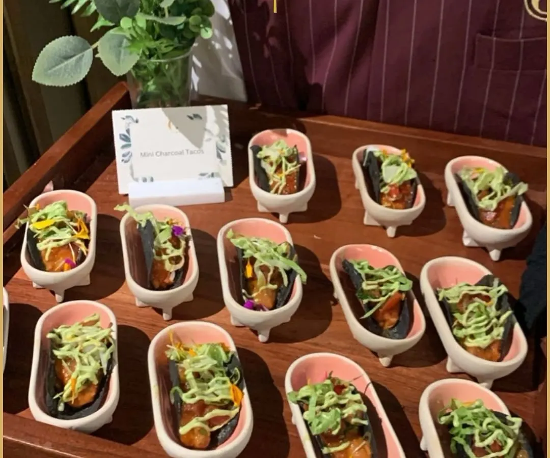 We believe in service with a touch of whimsy. Our Mini Charcoal Tacos are served in charming miniature bathtubs, a presentation that is not only memorable but also a perfect conversation starter for your corporate event.