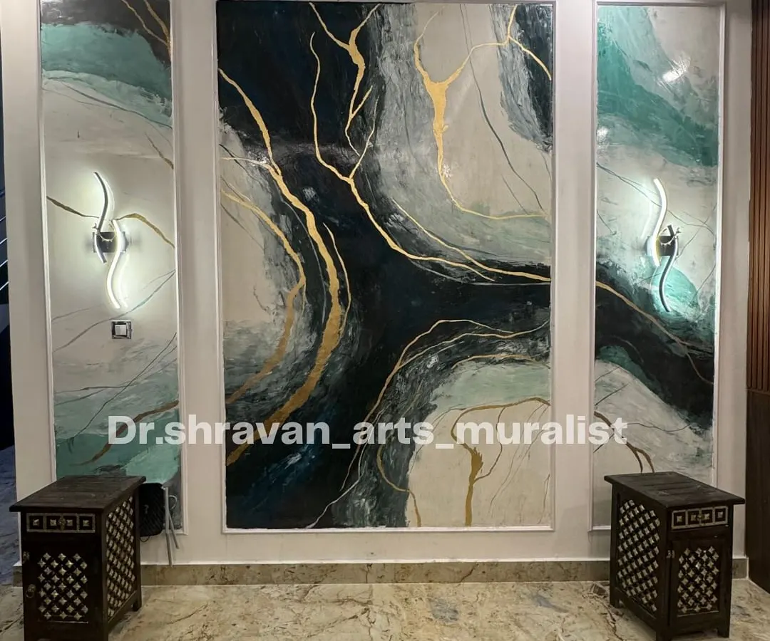 We love adding a touch of luxury to a home. This granite-effect mural, created as a triptych, transforms the living room wall into a modern art installation. The deep colors and veins of gold foil catch the light beautifully, creating a dynamic and sophisticated focal point.