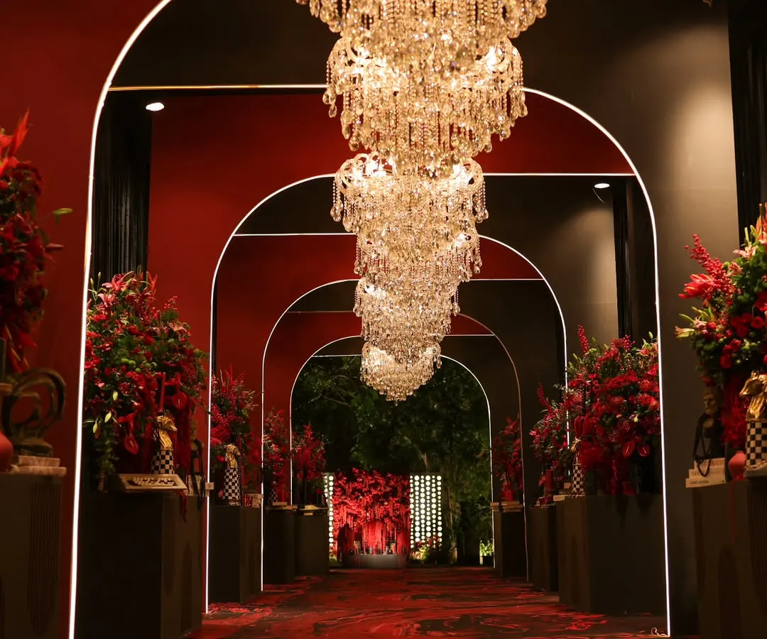 We believe the first impression is the last. This dramatic arched entryway, designed for a 'Red Royal Affair' cocktail night, promises a journey into an evening of unparalleled luxury and passion. ❤️