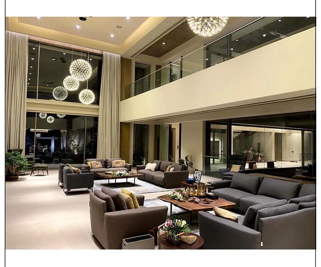We believe a living room should be an oasis of comfort and style. For this home in Aamby Valley, we designed a double-height space with a dramatic chandelier and plush seating to create a beautiful blend of contemporary and cozy design elements.