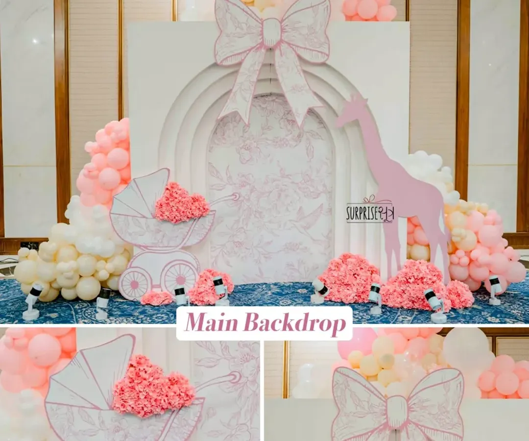 For this special baby welcome, the family wanted something truly luxurious, so I designed this Dior-inspired main backdrop. The intricate details, soft pink and white palette, and custom-made props like the baby carriage created an atmosphere of pure elegance.
