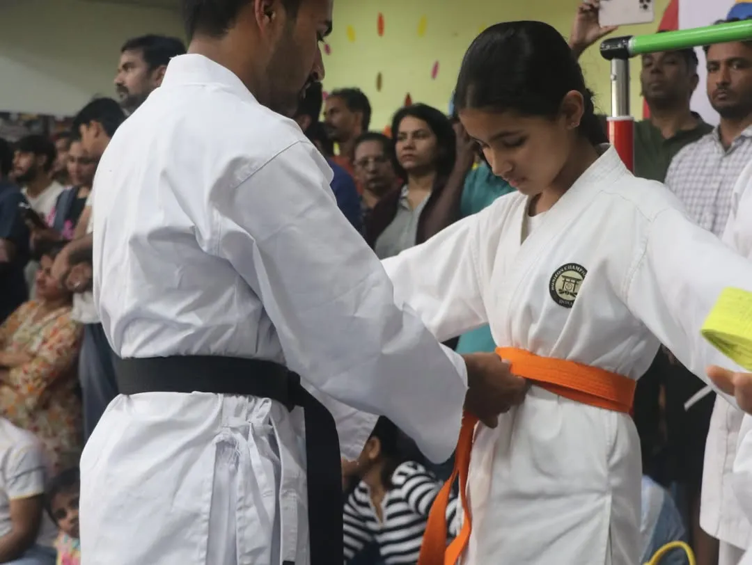 A significant moment for every student. Here, I am awarding a new belt, which is a symbol of their hard work, dedication, and progress on their karate journey.