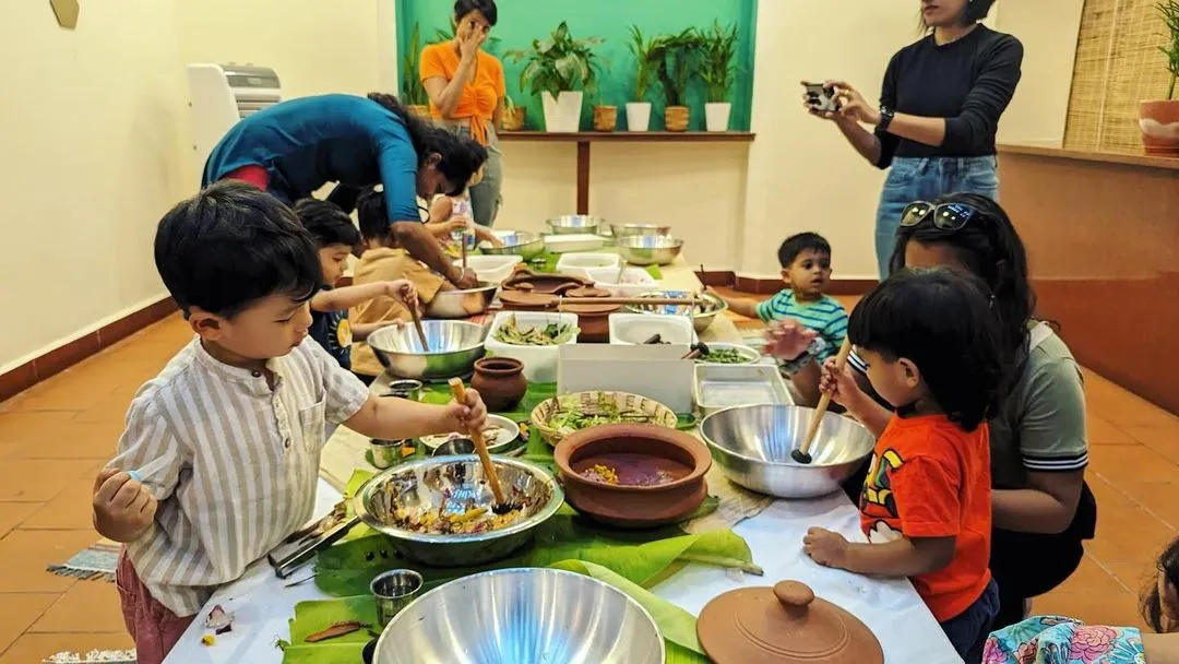There is so much joy in mixing and making. Here, our little adventurers are busy creating their own nature potions at a sensory table. Using leaves, twigs, sand, and a lot of imagination, this parent-child activity is all about hands-on, collaborative fun.