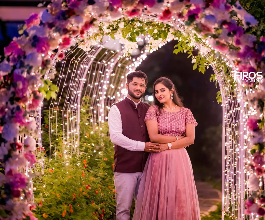 Nothing says magic like a tunnel of fairy lights. I love creating these enchanting evening settings that make you feel like you are the only two people in the world. This is a perfect example of a romantic couple portrait.