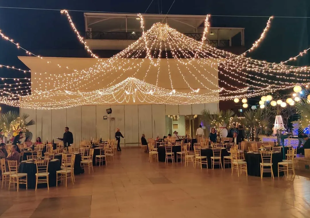 I can transform vast outdoor spaces for large-scale corporate functions. This image shows a gala dinner setup, where I used an extensive canopy of string lights to create a warm, sophisticated ambiance for hundreds of guests, ensuring a memorable evening event.