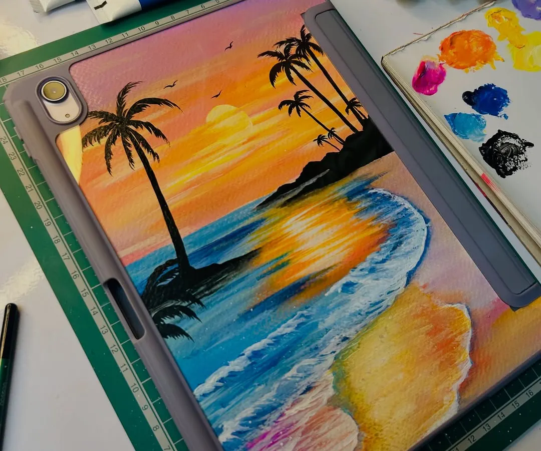 I love bringing dreamy beach sunsets to life on my custom iPad covers. This piece captures the warm glow of the sun and the texture of the waves using vibrant acrylic paints. The artwork is painted on a custom-fit insert, ensuring it stays protected and beautiful.