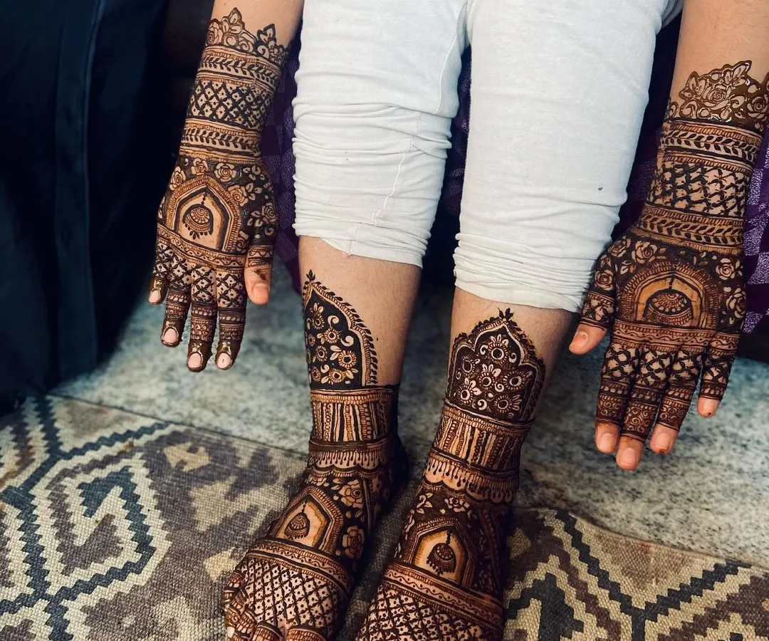 A complete bridal mehendi set, with matching intricate designs for both hands and feet. This shows the full coverage I offer, extending up the forearms and mid-calf, creating a cohesive and stunning look for your wedding day.