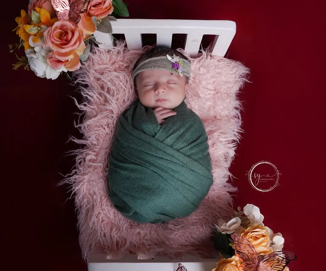 There is nothing more peaceful than a sleeping newborn. I create a calm and safe environment in my studio to capture these delicate first moments, swaddled in soft fabrics and surrounded by beautiful floral props.
