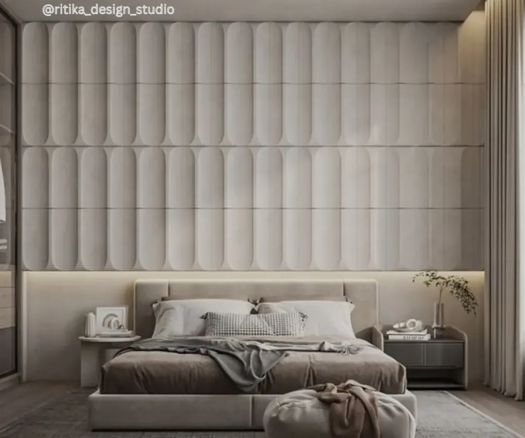 I believe a bedroom should be a luxurious retreat. Here, the floor-to-ceiling upholstered wall paneling creates a dramatic yet soft focal point. The layered neutral tones, plush fabrics, and ambient lighting come together to form a serene and sophisticated space designed for ultimate relaxation.