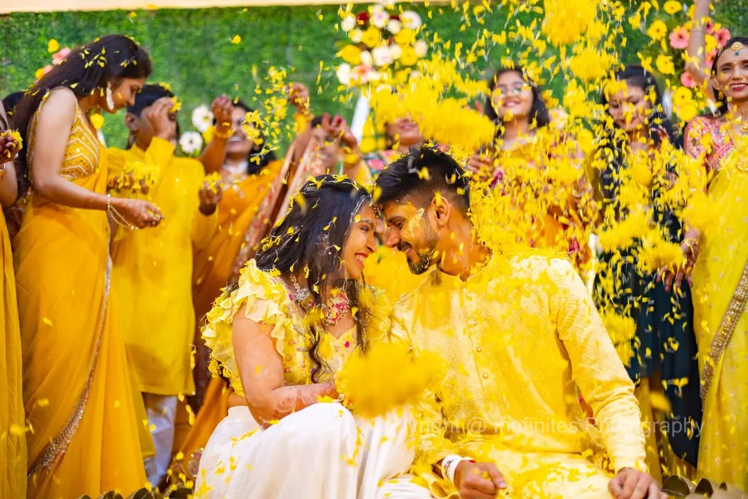 The Haldi ceremony is pure, unfiltered joy. My team and I position ourselves to capture the energy from every angle, ensuring we get these vibrant, action-filled shots that you will cherish forever.