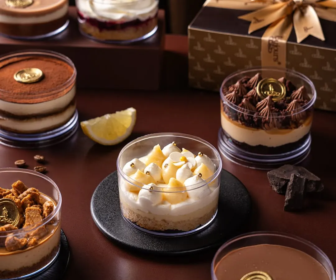 A glimpse into my late-night dessert menu, handcrafted in small batches. From the zesty Lemon Cake to the classic Tiramisu, each dessert tub is a personal treat, also available in a curated gift box.