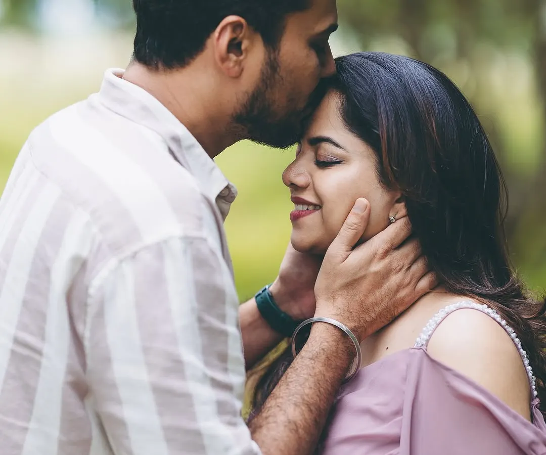 A quiet moment of connection. This close-up shot during an outdoor session captures the pure love and anticipation between partners, a memory to cherish forever.