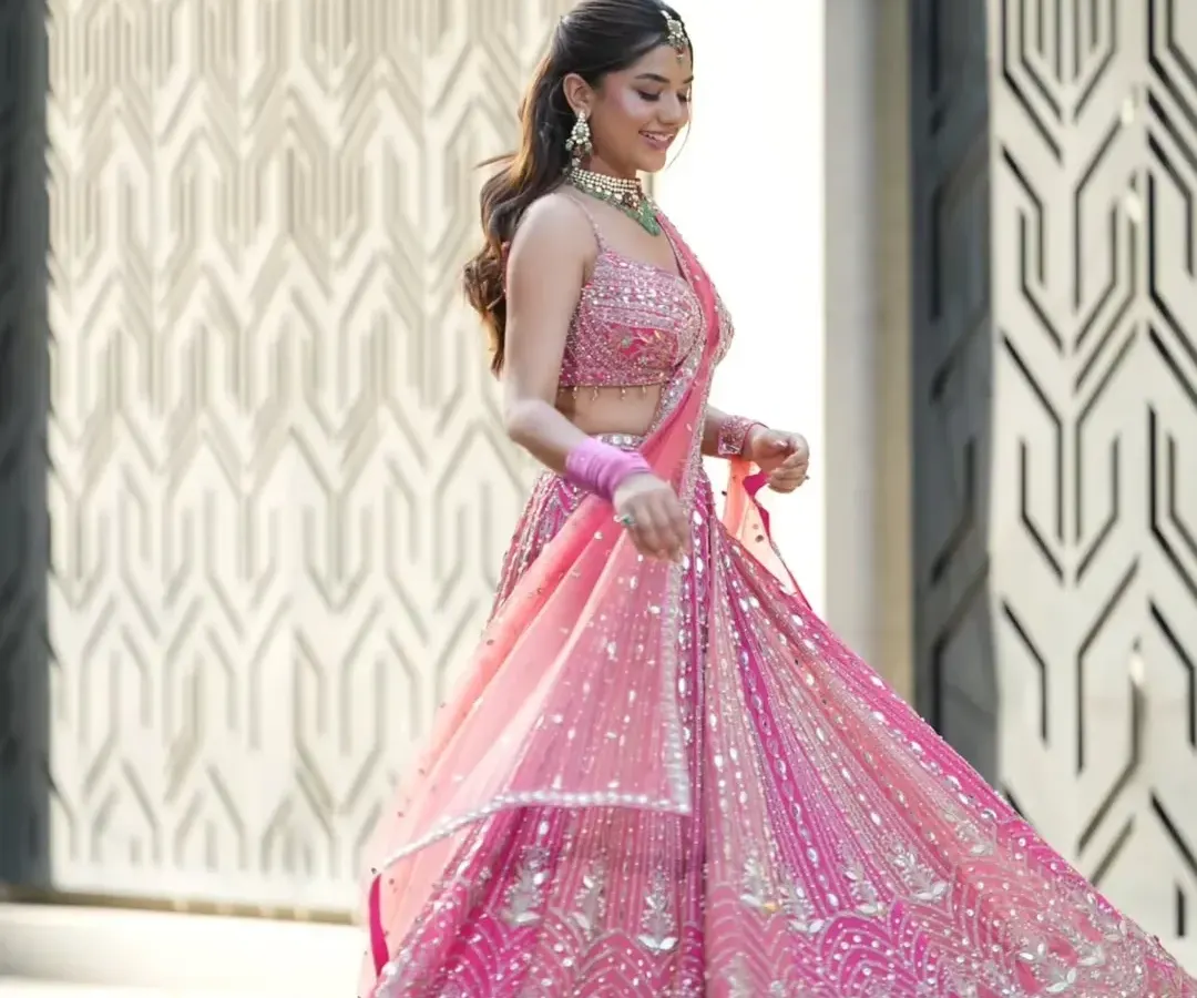 Feel the joy of celebration in this stunning, twirl-worthy pink lehenga. Perfect for a sangeet, engagement, or even a modern bridal look, my rental collection offers vibrant, designer outfits that make a statement and create unforgettable photos.
