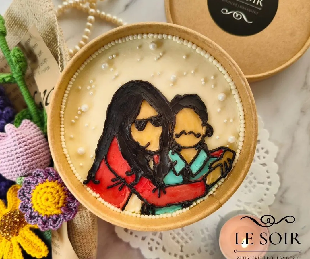 This is how I bring your memories to life on a cake. This custom portrait cake tub features a hand-piped illustration of a mother and child, making for a truly personal and delicious gift.