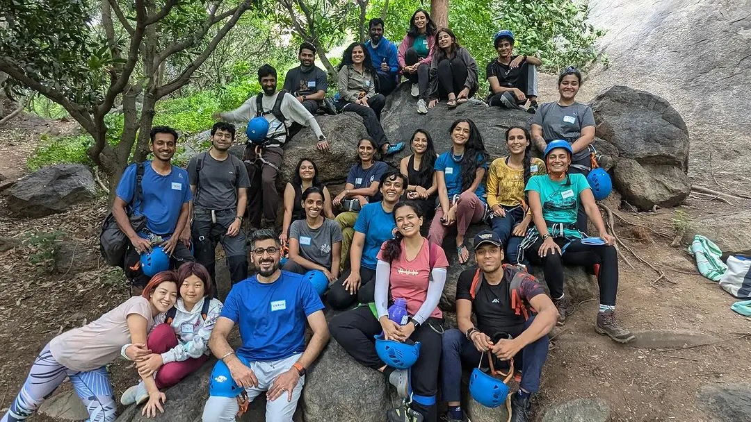 This is our tribe. A smiling, supportive group of adventurers from all walks of life, celebrating a day पुलिस on the rocks. When you join our workshops, you're not just learning to climb; you're finding your people.