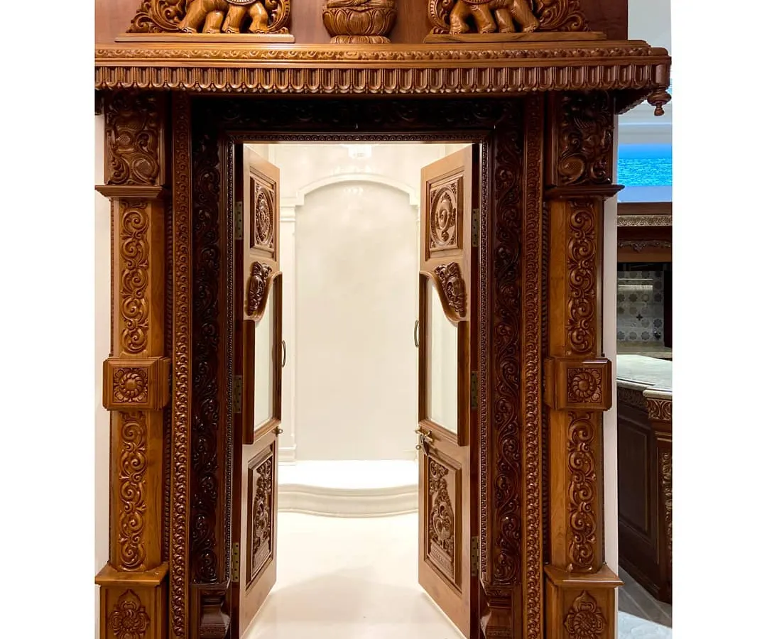 I believe a pooja room should be a sanctuary. For this luxury residence, my team designed and commissioned this magnificent, hand-carved traditional wooden doorway, creating a truly divine entrance that becomes the spiritual heart of the home.