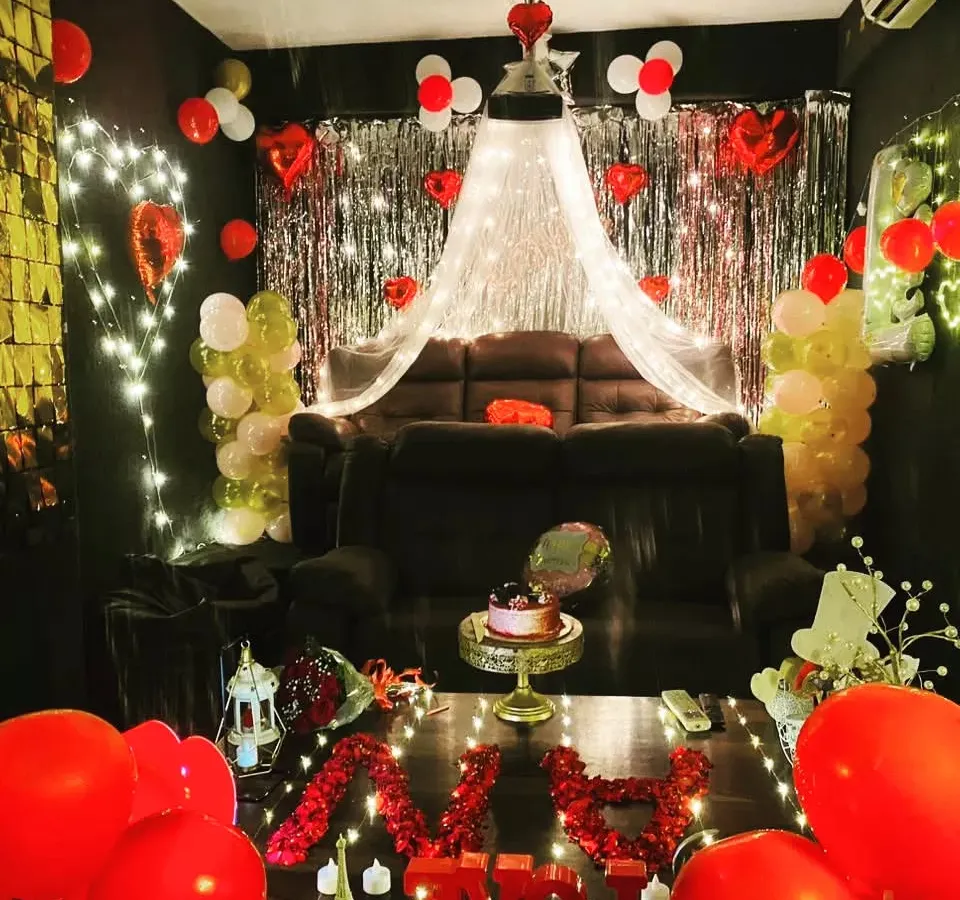 This is how we do romantic celebrations. Imagine just you and your special someone, surrounded by lights, balloons, and a cozy canopy, ready to watch your favorite movie. It's the perfect setup for a Valentine's surprise or a memorable birthday.