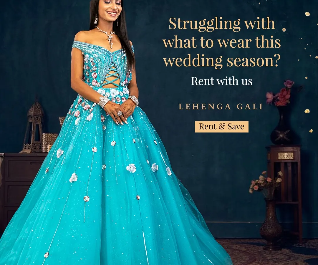 Make a bold statement at any sangeet or reception with this vibrant turquoise ball gown. The off-shoulder design and voluminous skirt are crafted for a fairytale moment, ensuring you are the center of attention. This is the perfect rental for a glamorous evening party.
