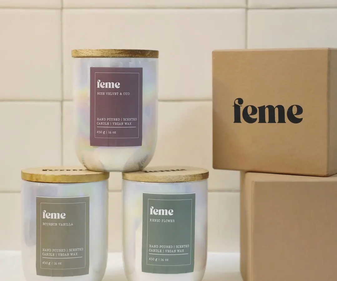 Our signature Holographic Jar candles, shown here with their gift-ready packaging. Each one is hand-poured with non-toxic soy wax, features a long-lasting 50-hour burn time, and comes with an engraved wooden lid.