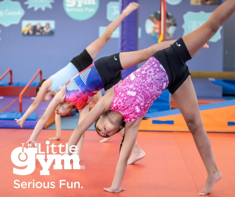 Teamwork makes the dream work. Here, a group of young gymnasts practices their cartwheels in unison, learning about timing, coordination, and the joy of moving together. This is a foundational skill for gymnastics and many other sports.
