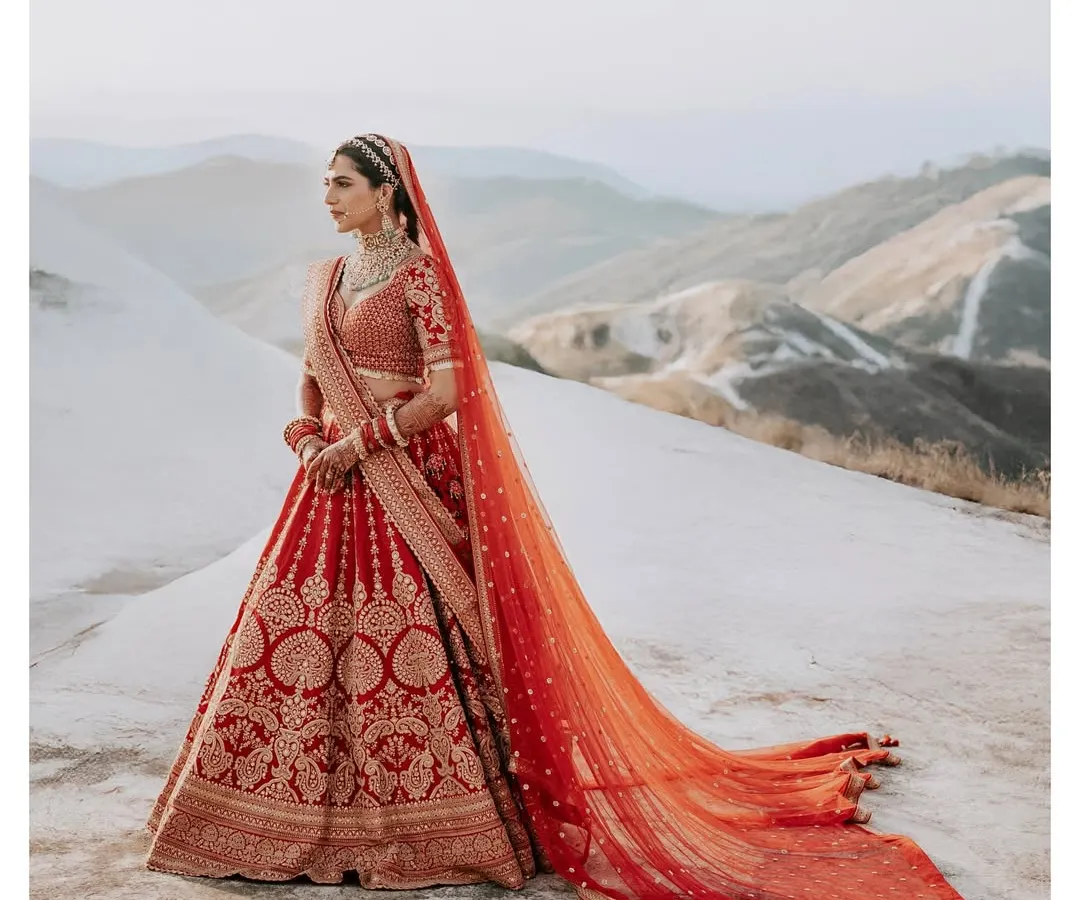A bridal portrait that feels as grand as the moment itself. I use dramatic landscapes, like these stunning mountains, to frame the bride not just as a subject, but as the hero of her own epic story.