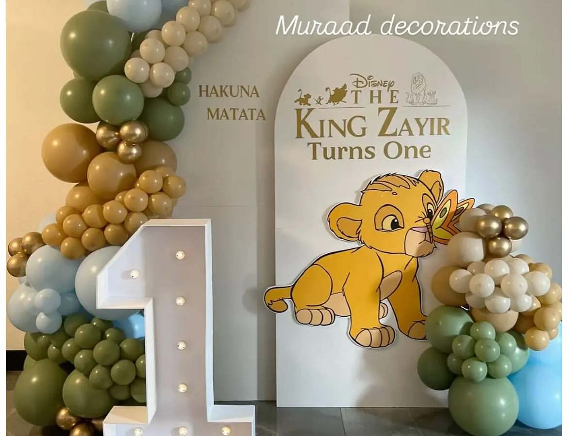 For this first birthday, we brought the world of The Lion King to life. The setup features a custom "Hakuna Matata" backdrop, a light-up marquee number '1', and a cute Simba cutout, creating a perfect photo spot for the little one.