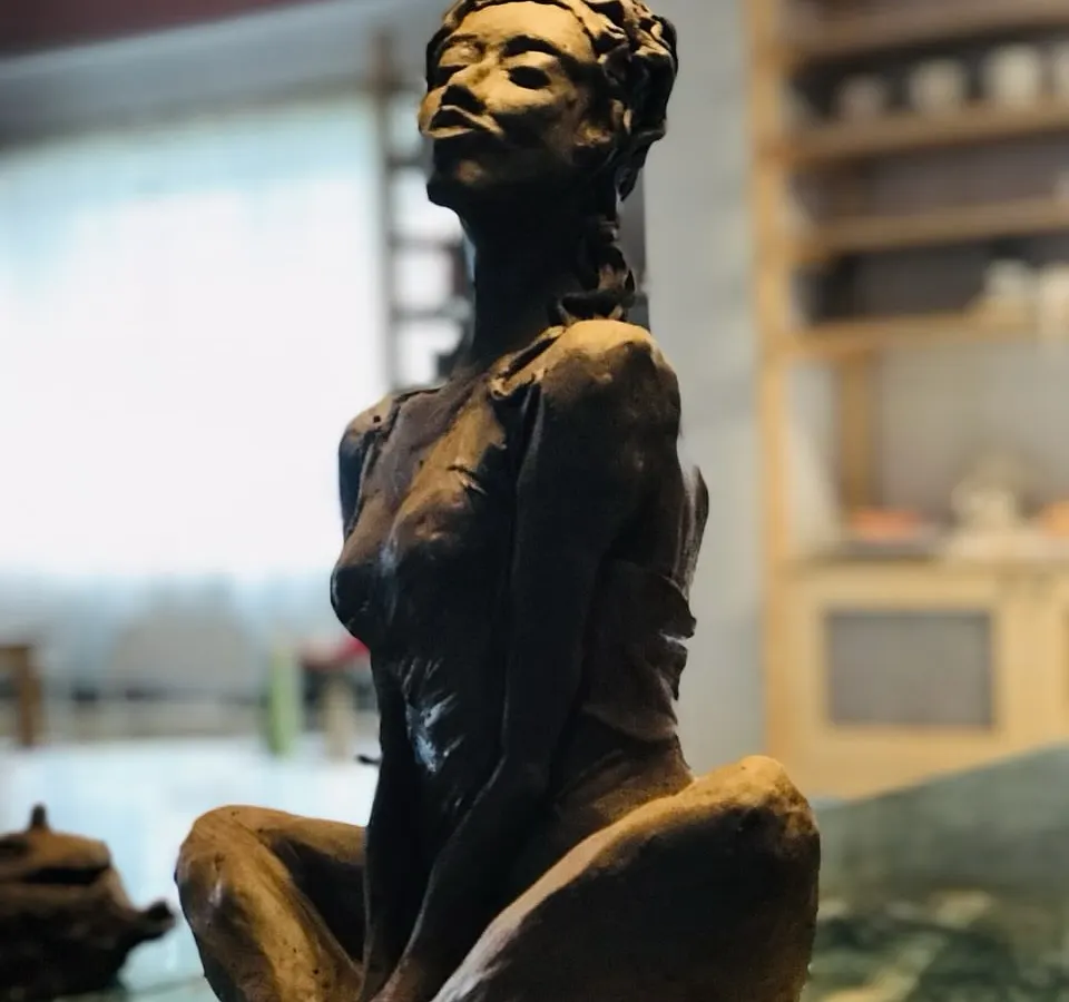 I love when my students pour their own stories into the clay. This terracotta sculpture, named "Naughty Girl," is a perfect example of capturing a spirit, a mood, and a bold personality in three-dimensional form.