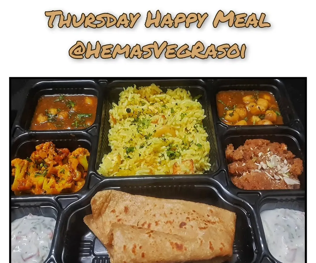 My Thursday Happy Meal is a complete, balanced vegetarian thali that brings the comfort of home to your office. It includes Paneer Pulao, Raita, Chole, Gobi, Parathas, and a sweet Sheera made with pure ghee.