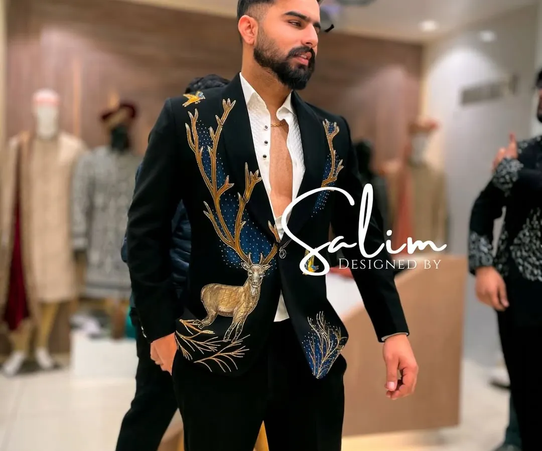 For a client who wanted something powerful and unique for a reception, I created this black velvet tuxedo jacket. It features a stunning, large-scale deer motif, hand-embroidered with thread and beadwork to create a piece of wearable art.