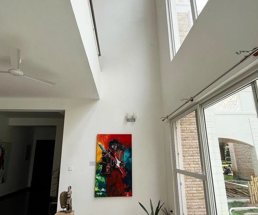 Our gallery is a 7,000 sq ft modern space with high, light-filled ceilings, designed to let large-scale artworks breathe. This piece, a vibrant portrait of Jimi Hendrix, shows how the architecture itself becomes part of the viewing experience.