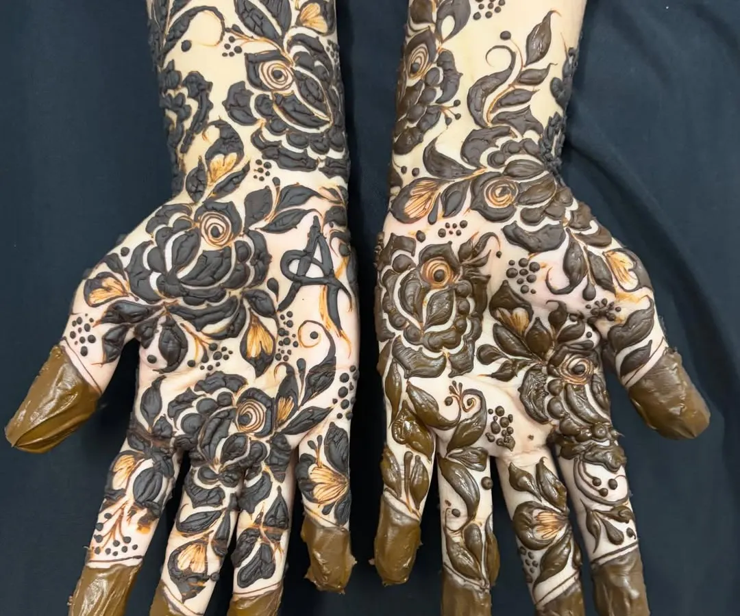 I love how this bold Gulf-style floral design makes a statement. The dark fill work makes the flowers pop, and adding a personal touch with an initial makes it extra special for my client.